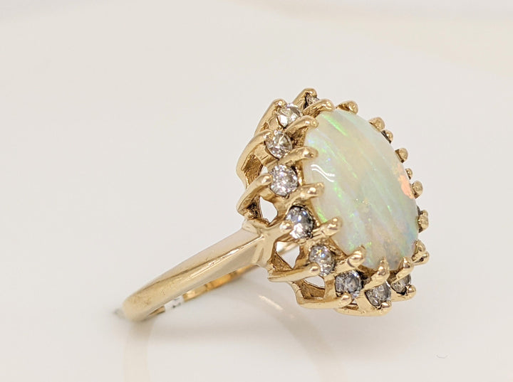 14K OPAL OVAL 9X11 WITH .15DTW (14) ESTATE RING 4.5 GRAMS