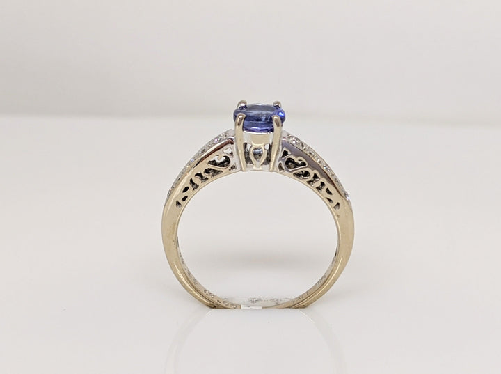 18K WHITE TANZANITE ROUND .65 CARAT TOTAL WITH .14 DIAMOND TOTAL WEIGHT (10) ROUND ESTATE RING 3.8 GRAMS