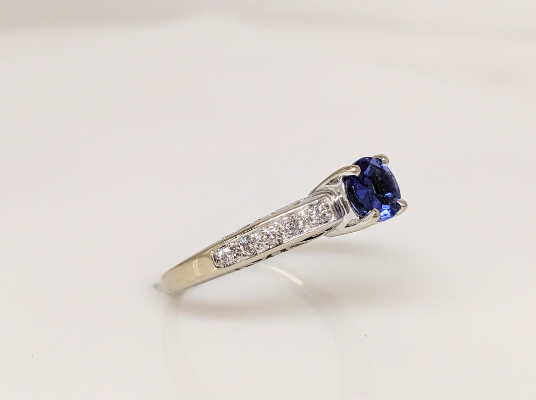 18K WHITE TANZANITE ROUND .65 CARAT TOTAL WITH .14 DIAMOND TOTAL WEIGHT (10) ROUND ESTATE RING 3.8 GRAMS