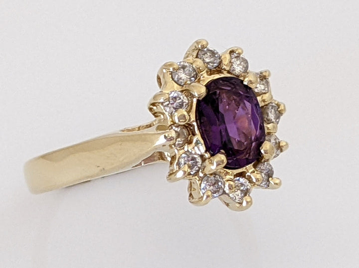 14K AMETHYST OVAL 5X7 WITH .24 DIAMOND TOTAL WEIGHT (12) ESTATE RING 4.6 GRAMS