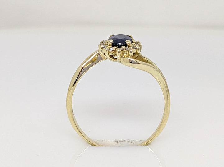 14K SAPPHIRE OVAL "A" WITH .10 DIAMOND TOTAL WEIGHT (12) ESTATE BYPASS RING 2.2 GRAMS