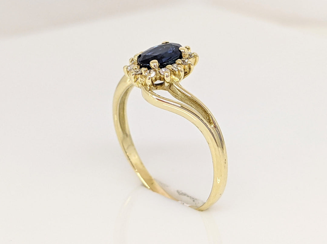 14K SAPPHIRE OVAL "A" WITH .10 DIAMOND TOTAL WEIGHT (12) ESTATE BYPASS RING 2.2 GRAMS