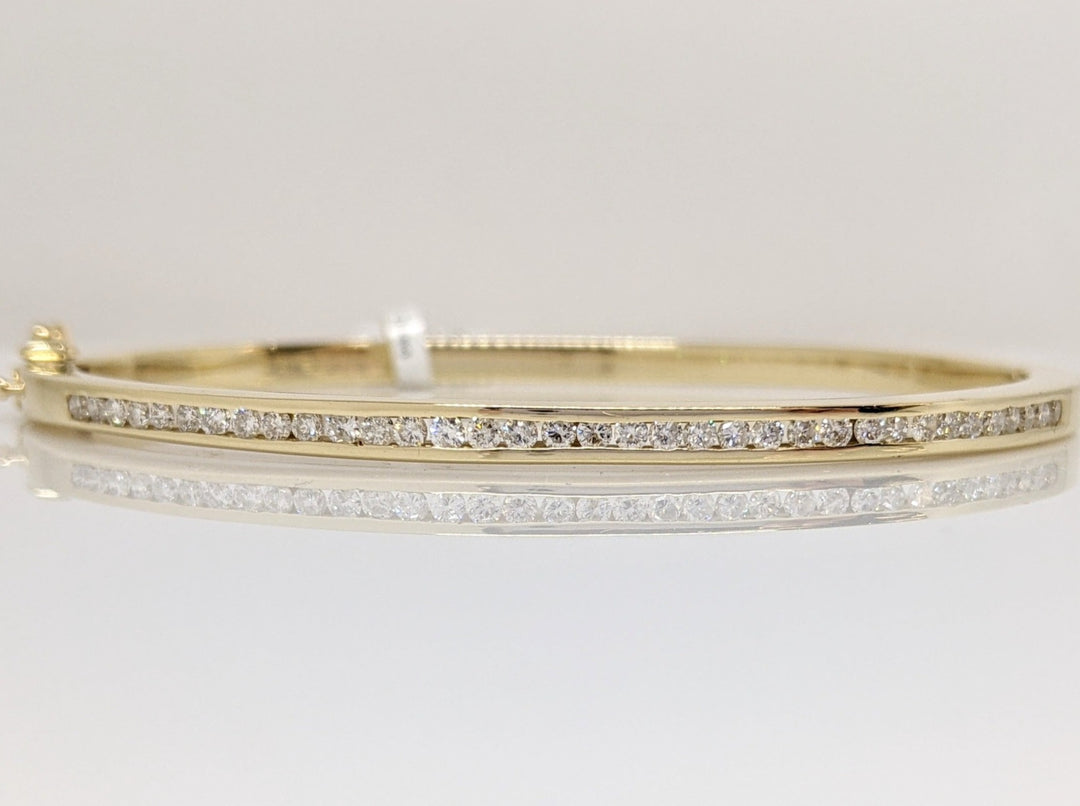 14K .70 CARAT TOTAL WEIGHT I1 I DIAMOND ROUND (35) CHANNEL SET ESTATE BANGLE 15.8 GRAMS