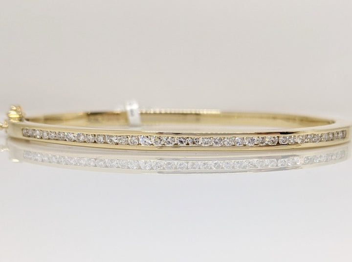 14K .70 CARAT TOTAL WEIGHT I1 I DIAMOND ROUND (35) CHANNEL SET ESTATE BANGLE 15.8 GRAMS