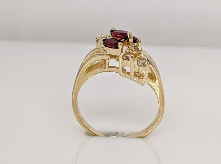 14K RUBY MARQUISE (3) 2.5X4 WITH .12 DIAMOND TOTAL WEIGHT I1 I (6) ROUND ESTATE RING 3.1 GRAMS