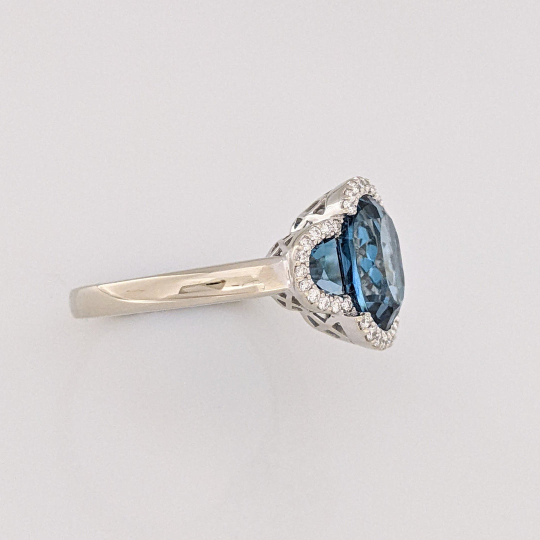 14K WHITE LONDON BLUE TOPAZ OVAL 8X10 WITH (2) TOPAZ AND .30 DIAMOND TOTAL WEIGHT ESTATE RING 4.3 GRAMS