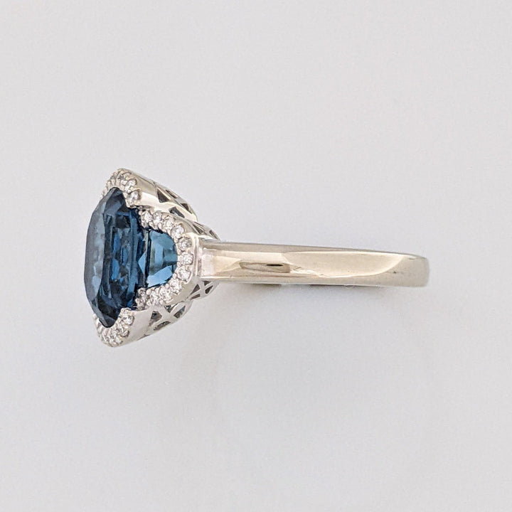 14K WHITE LONDON BLUE TOPAZ OVAL 8X10 WITH (2) TOPAZ AND .30 DIAMOND TOTAL WEIGHT ESTATE RING 4.3 GRAMS