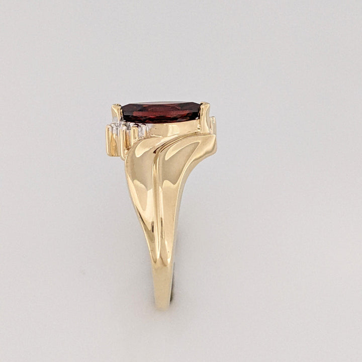 10K GARNET MARQUISE 5X10 WITH (2) MELEE ESTATE RING 2.7 GRAMS