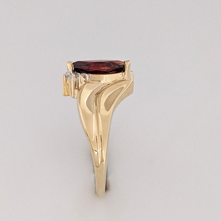 10K GARNET MARQUISE 5X10 WITH (2) MELEE ESTATE RING 2.7 GRAMS