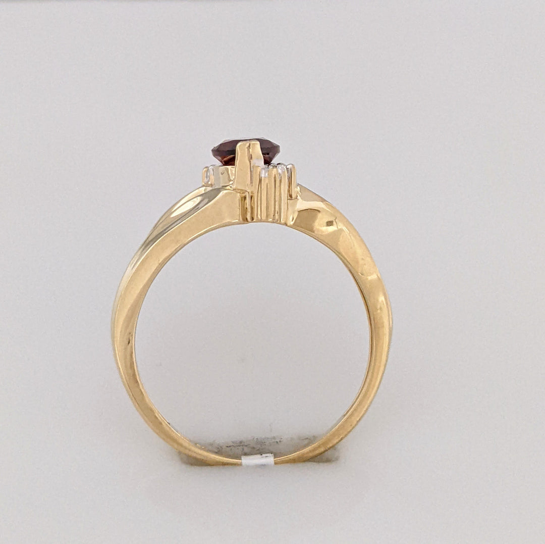 10K GARNET MARQUISE 5X10 WITH (2) MELEE ESTATE RING 2.7 GRAMS