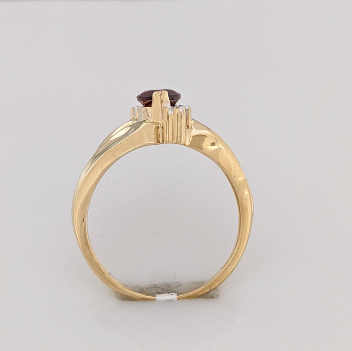 10K GARNET MARQUISE 5X10 WITH (2) MELEE ESTATE RING 2.7 GRAMS