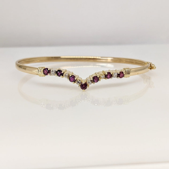 14K RUBY ROUND (7) 2.8-3MM WITH (6) MELEE ESTATE V-BANGLE 6.0 GRAMS