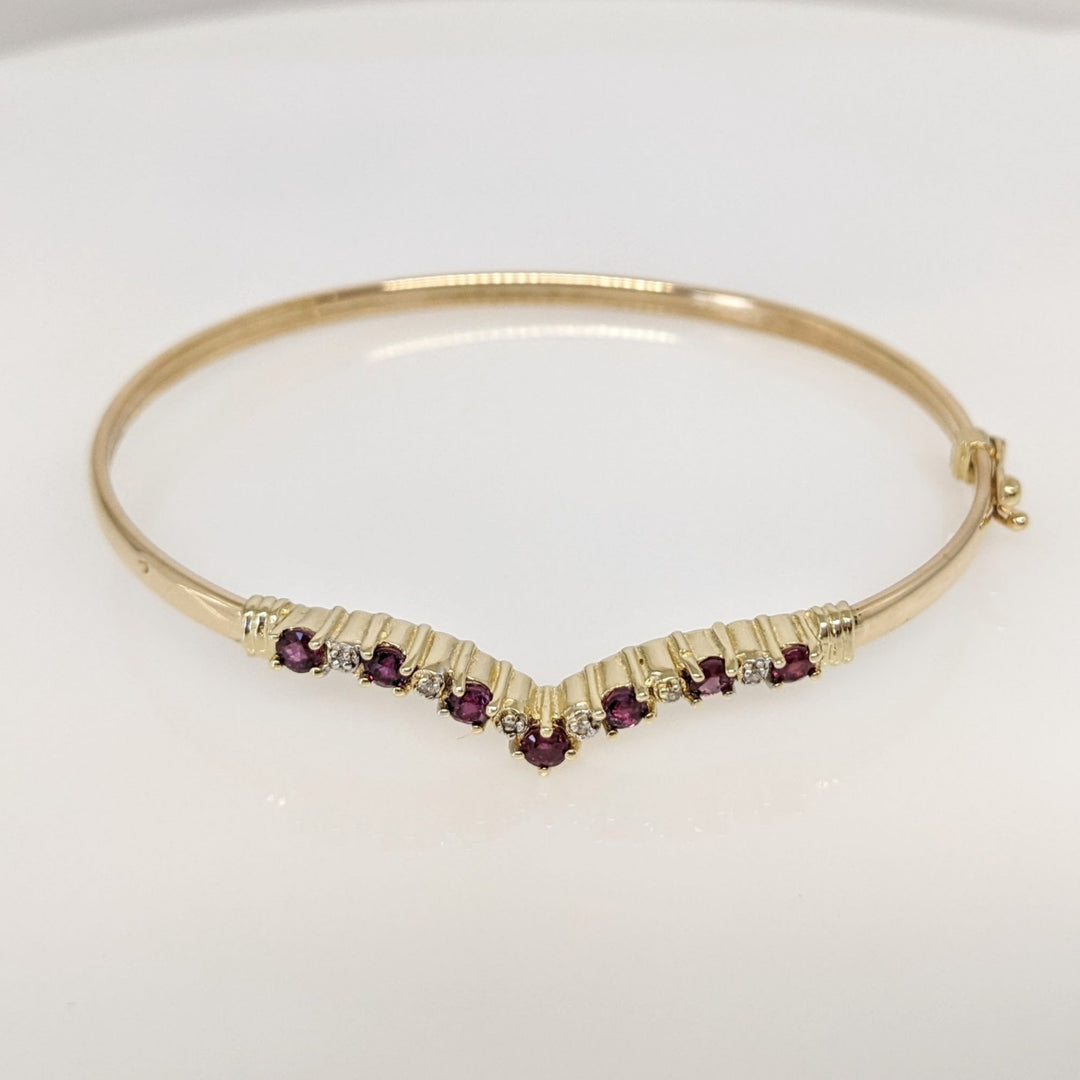 14K RUBY ROUND (7) 2.8-3MM WITH (6) MELEE ESTATE V-BANGLE 6.0 GRAMS