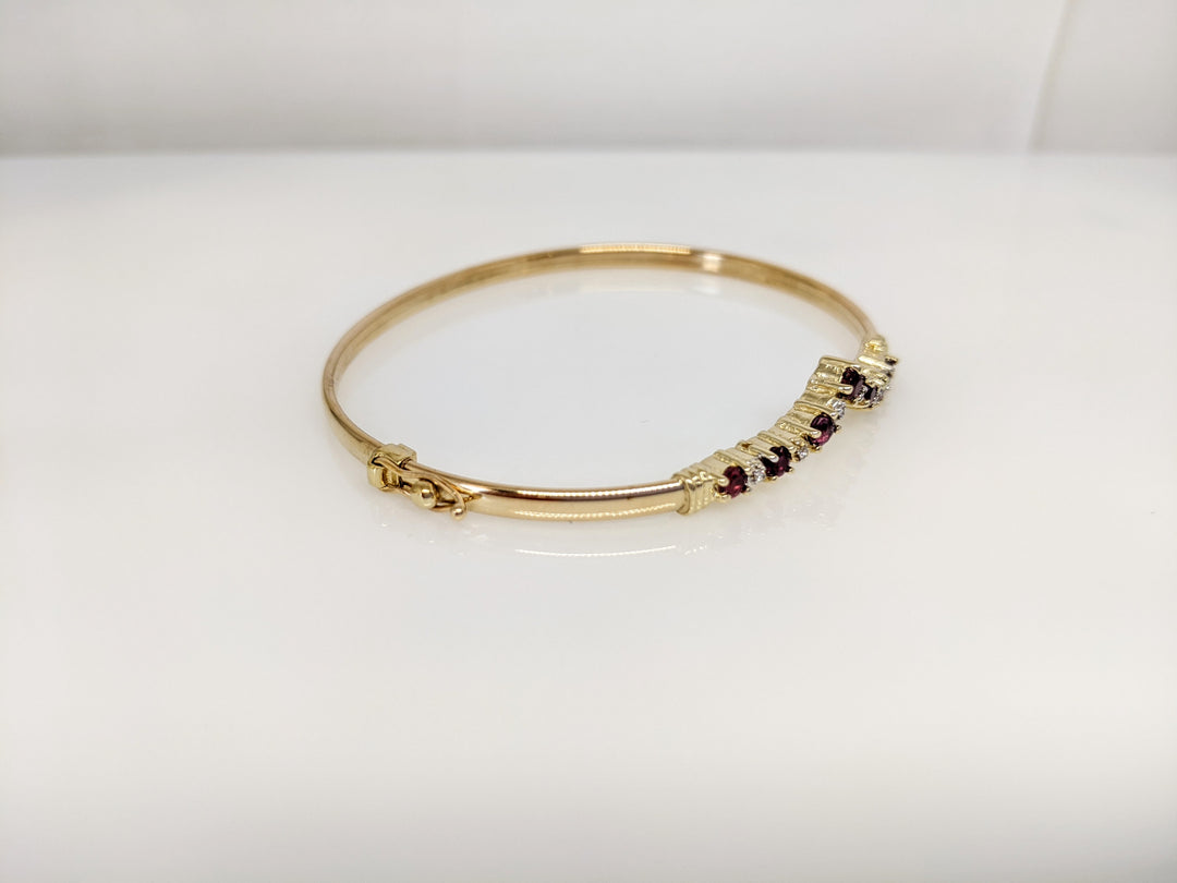 14K RUBY ROUND (7) 2.8-3MM WITH (6) MELEE ESTATE V-BANGLE 6.0 GRAMS