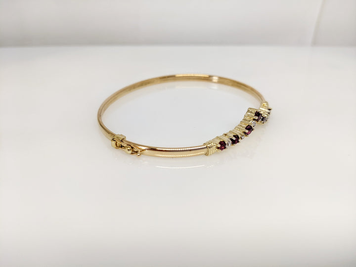 14K RUBY ROUND (7) 2.8-3MM WITH (6) MELEE ESTATE V BANGLE 6.0 GRAMS