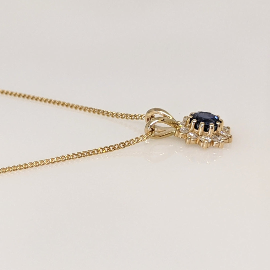 14K SAPPHIRE ROUND 4.3MM WITH .27DTW (9) ESTATE PENDANT & CHAIN 2.5 GRAMS