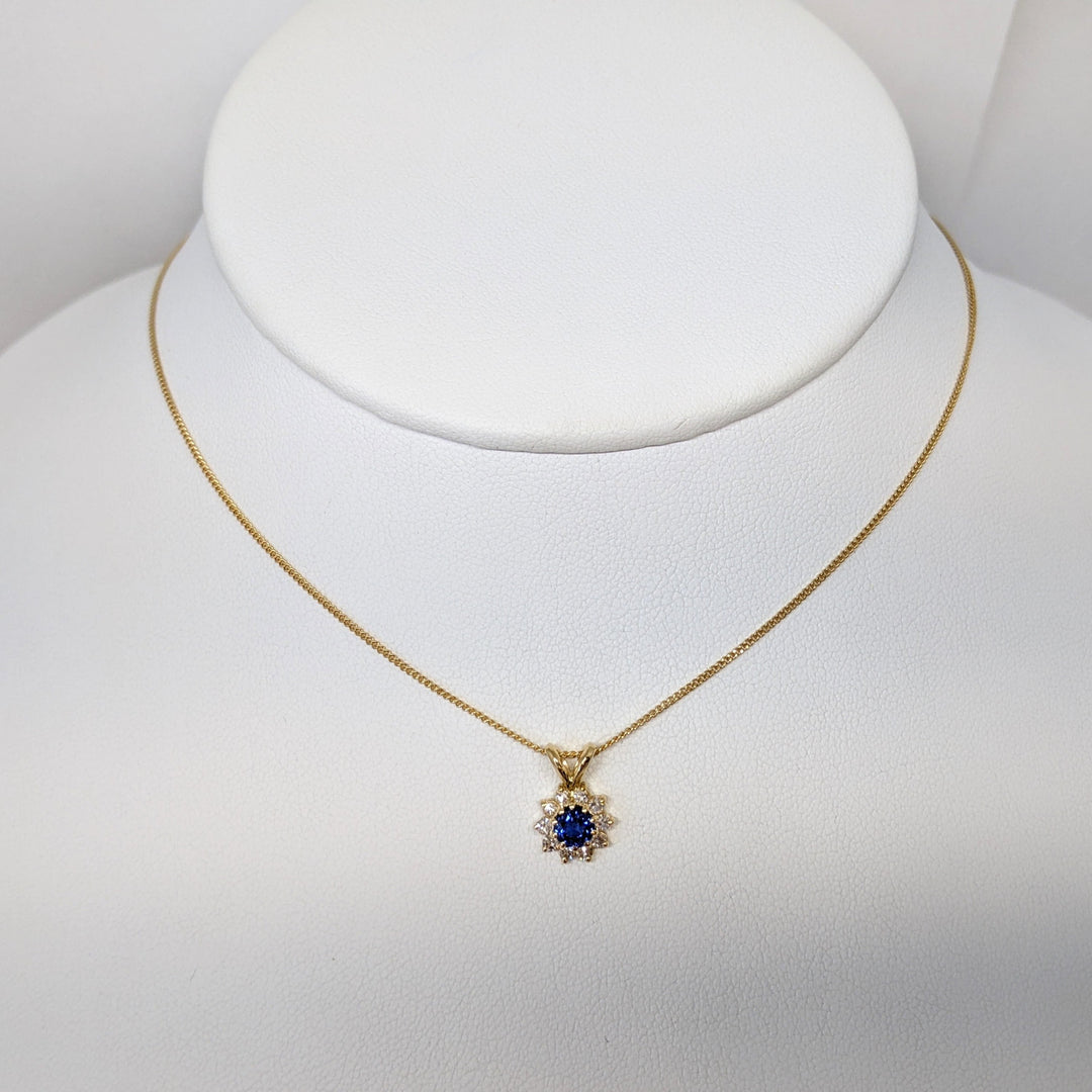 14K SAPPHIRE ROUND 4.3MM WITH .27DTW (9) ESTATE PENDANT & CHAIN 2.5 GRAMS