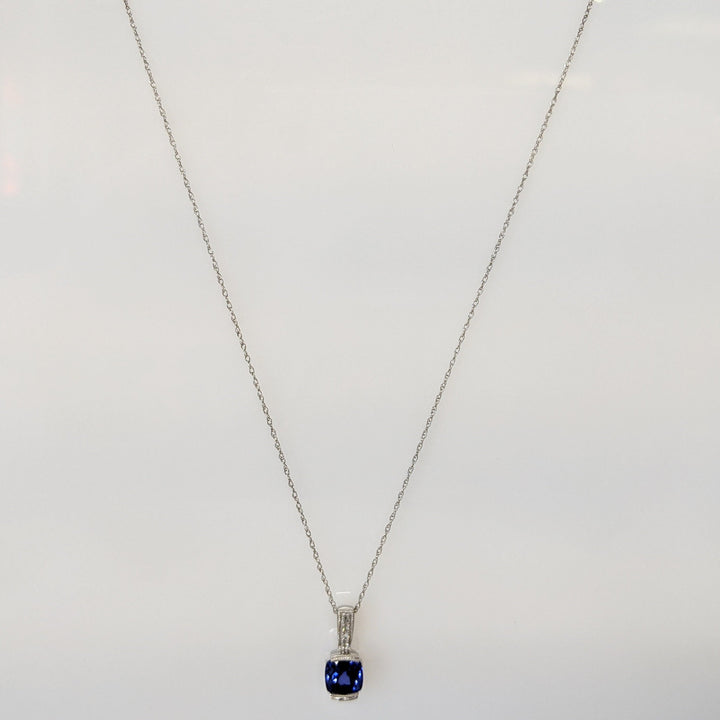 10K WHITE LAB CREATED SAPPHIRE CUSHION CUT 7X7 WITH (6) MELEE ESTATE PENDANT & CHAIN 2.1 GRAMS