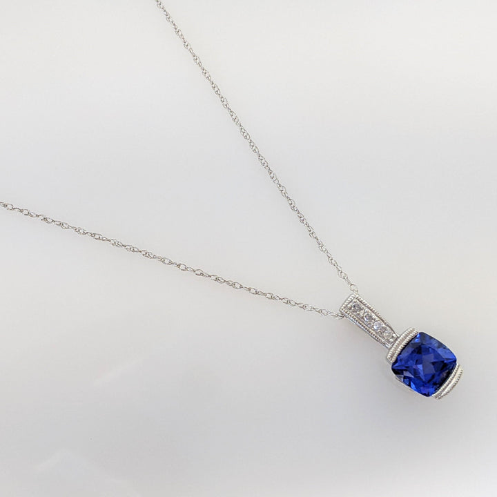 10K WHITE LAB CREATED SAPPHIRE CUSHION CUT 7X7 WITH (6) MELEE ESTATE PENDANT & CHAIN 2.1 GRAMS