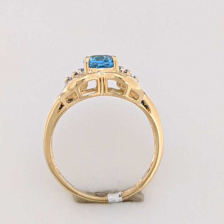 10K BLUE TOPAZ OVAL 6X8 WTIH (12) 2MM PRINCESS CUT AND (6) MELEE ESTATE RING 4.2 GRAMS