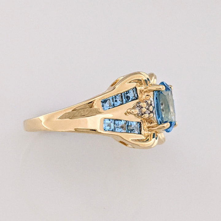 10K BLUE TOPAZ OVAL 6X8 WTIH (12) 2MM PRINCESS CUT AND (6) MELEE ESTATE RING 4.2 GRAMS