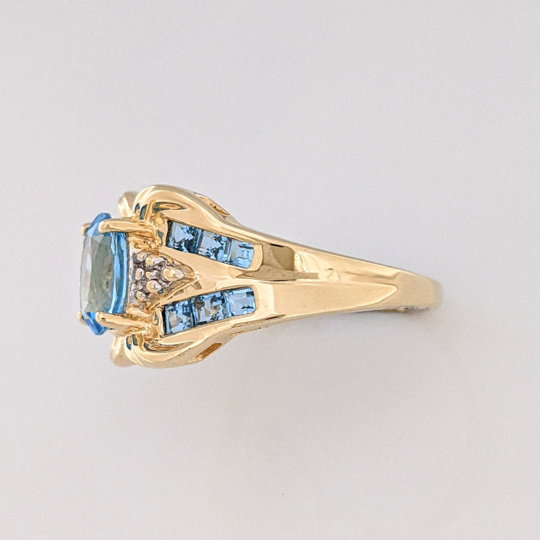 10K BLUE TOPAZ OVAL 6X8 WTIH (12) 2MM PRINCESS CUT AND (6) MELEE ESTATE RING 4.2 GRAMS