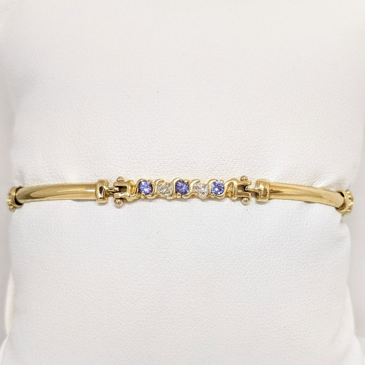 14K DIAMOND ROUND (6) .06CTW WITH (9) TANZANITE ROUND 2.5MM ESTATE BRACELET 8.1 GRAMS