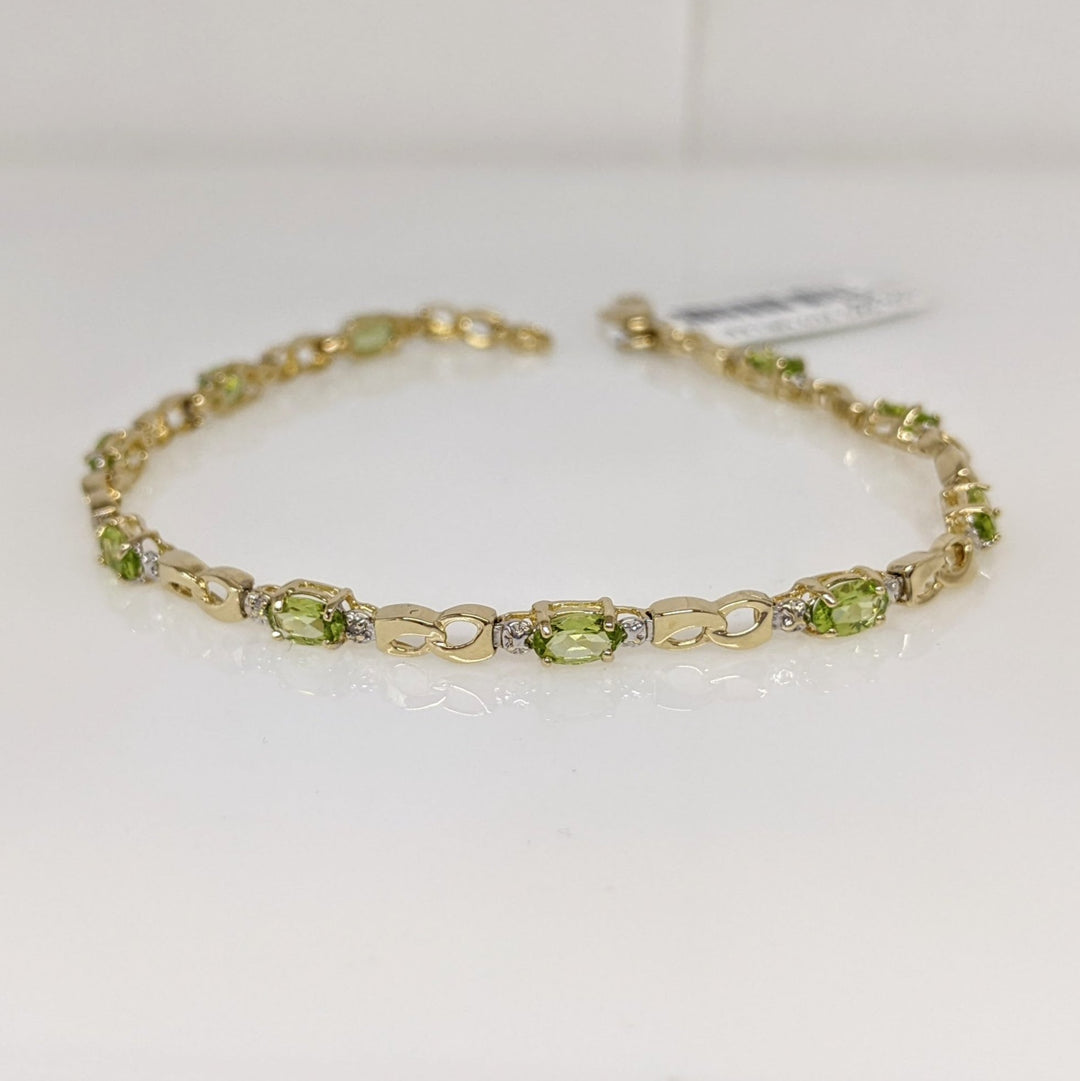 10K PERIDOT OVAL (10) 3X5 WITH (2) MELEE ESTATE BRACELET 4.0 GRAMS