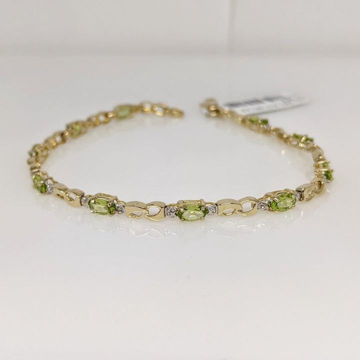 10K PERIDOT OVAL (10) 3X5 WITH (2) MELEE ESTATE BRACELET 4.0 GRAMS