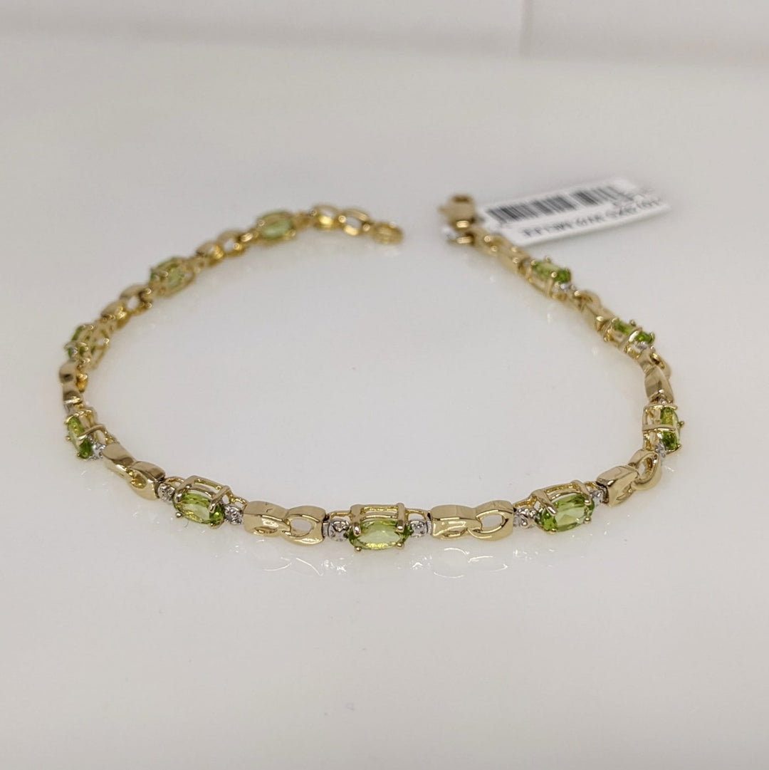 10K PERIDOT OVAL (10) 3X5 WITH (2) MELEE ESTATE BRACELET 4.0 GRAMS