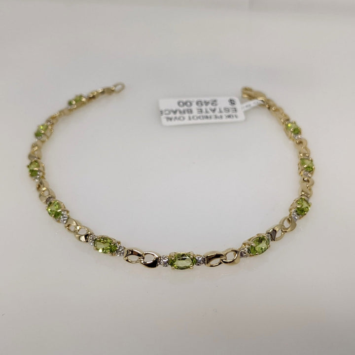 10K PERIDOT OVAL (10) 3X5 WITH (2) MELEE ESTATE BRACELET 4.0 GRAMS