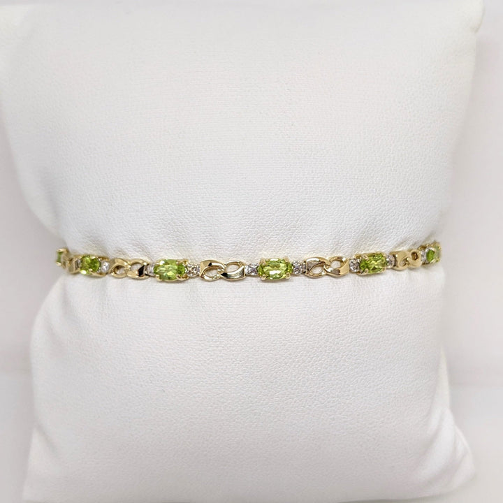 10K PERIDOT OVAL (10) 3X5 WITH (2) MELEE ESTATE BRACELET 4.0 GRAMS