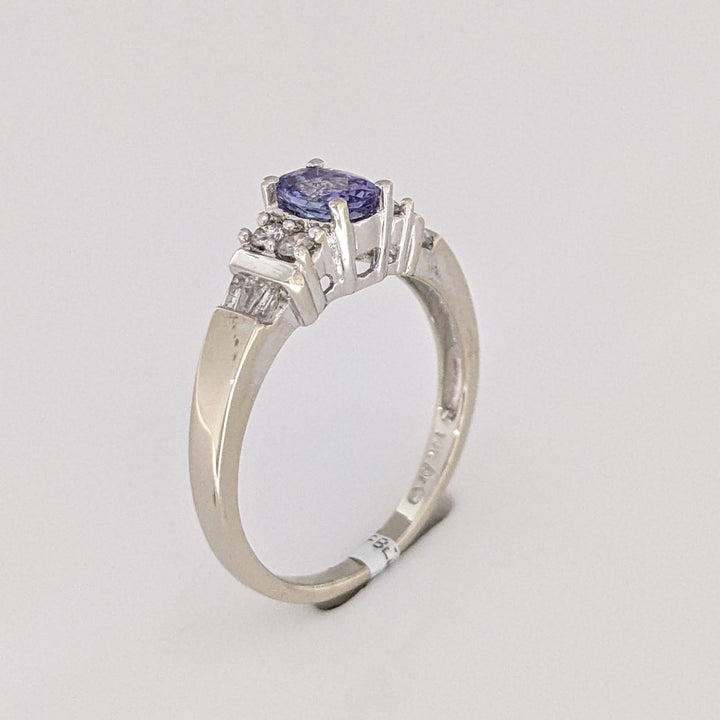 14K WHITE TANZANITE OVAL 4X6 WITH (4) ROUND MELEE AND (6) BAGUETTE ESTATE RING 2.8 GRAMS