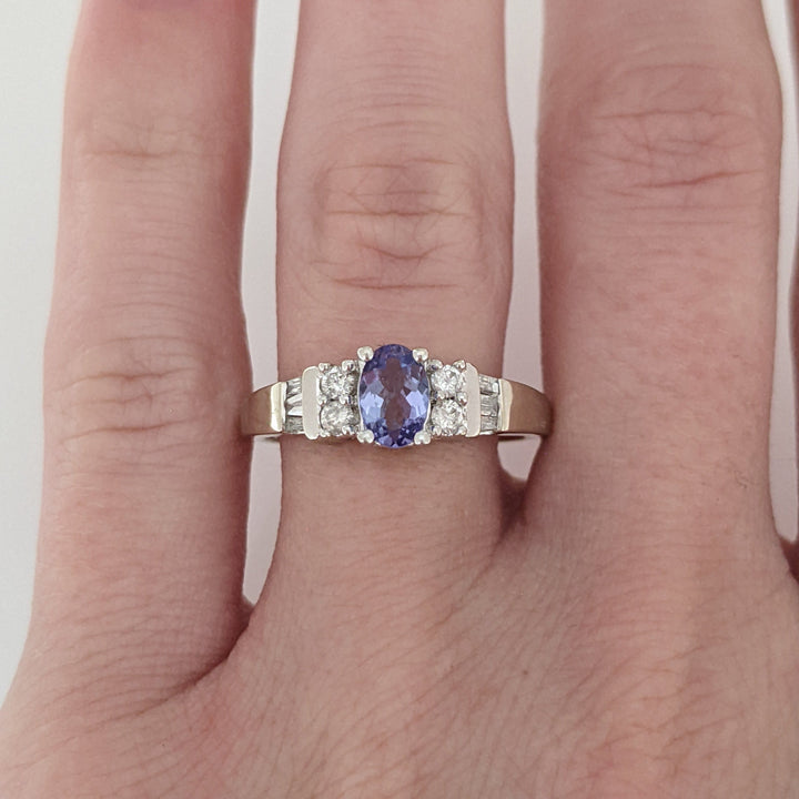 14K WHITE TANZANITE OVAL 4X6 WITH (4) ROUND MELEE AND (6) BAGUETTE ESTATE RING 2.8 GRAMS