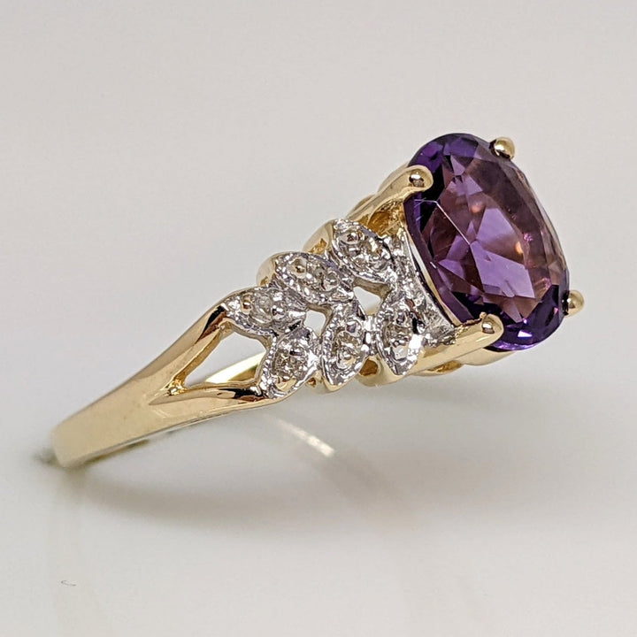 14K AMETHYST OVAL 7X9WITH (6) MELEE ESTATE RING 4.2 GRAMS