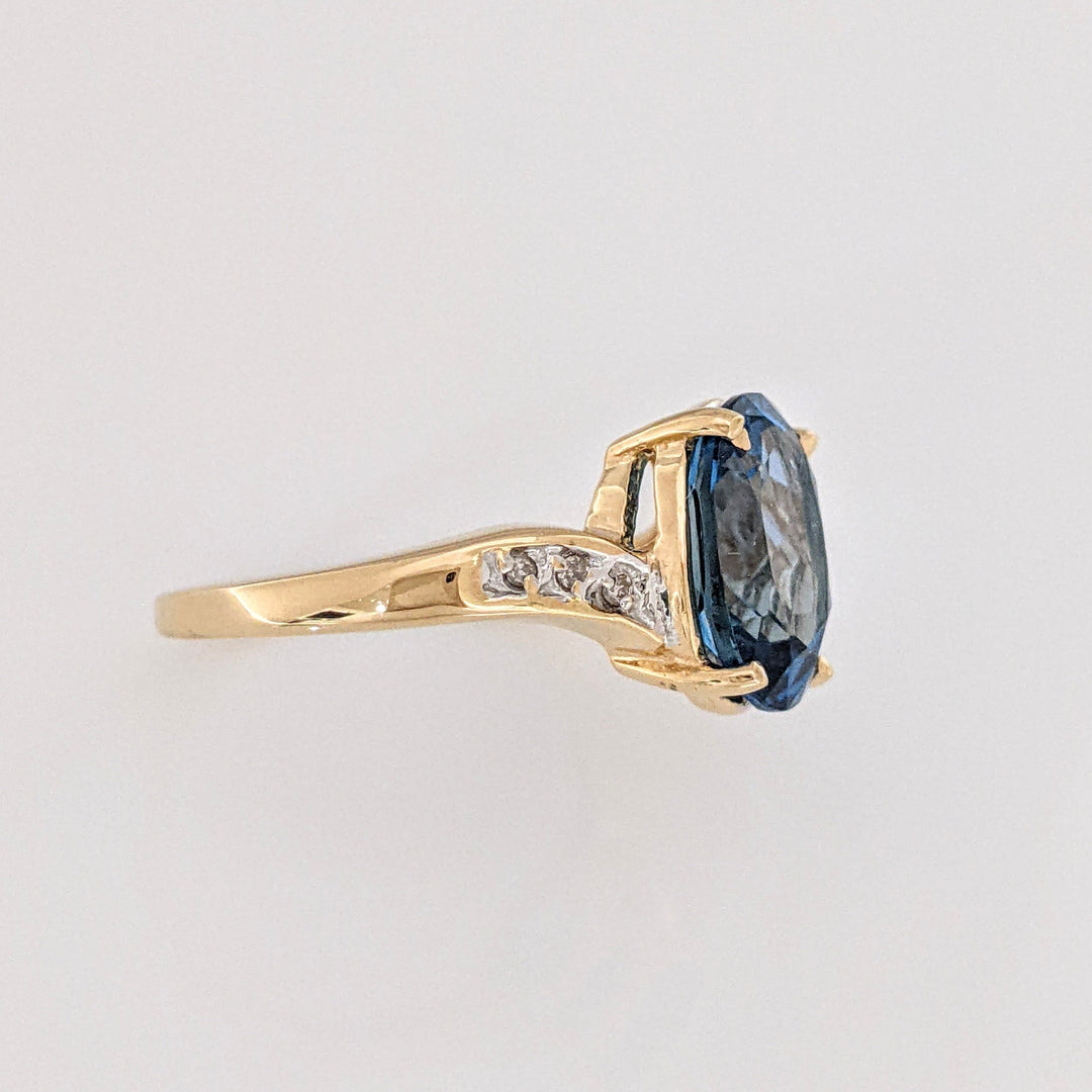 14K LONDON BLUE TOPAZ OVAL 9X11 WITH (6) DIAMONDS ESTATE RING 3.4 GRAMS