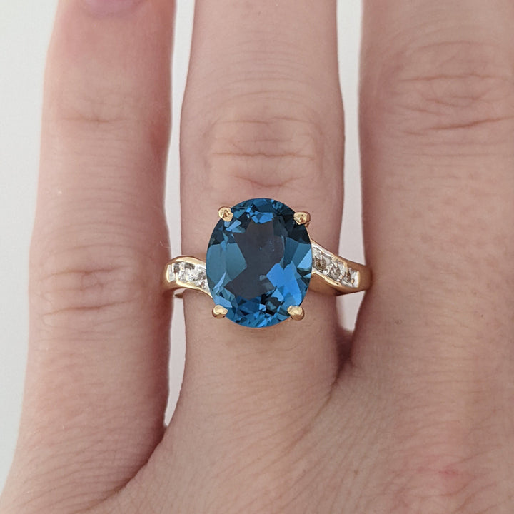 14K LONDON BLUE TOPAZ OVAL 9X11 WITH (6) DIAMONDS ESTATE RING 3.4 GRAMS