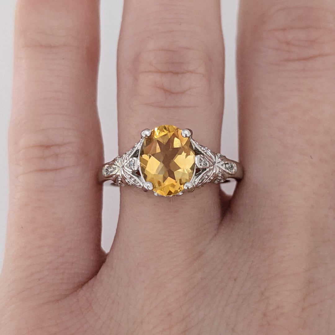 10K WHITE CITRINE OVAL 7X9 WITH MELEE ESTATE RING 3.8 GRAMS