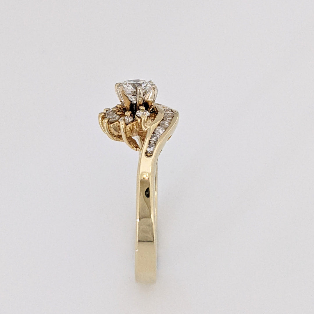 14K .71 CARAT TOTAL WEIGHT SI2-I1 H DIAMOND ROUND WITH BAGUETTE(6) AND MELEE(12) ESTATE RING 3.6 GRAMS