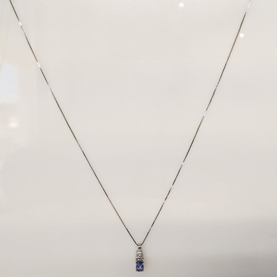 14K WHITE TANZANITE OVAL 4X6 WITH (2) ROUND AND (3) BAGUETTE DIAMONDS ESTATE PENDANT & CHAIN 1.9 GRAMS