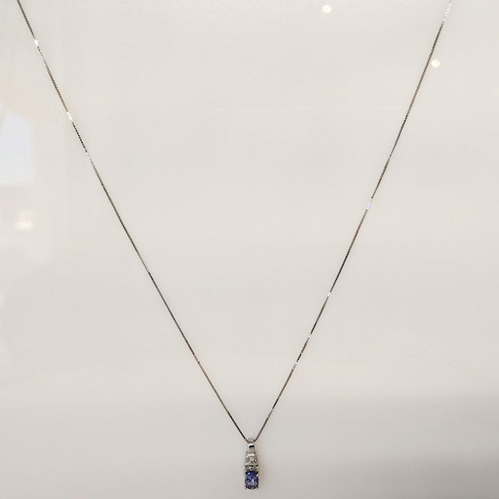 14K WHITE TANZANITE OVAL 4X6 WITH (2) ROUND AND (3) BAGUETTE DIAMONDS ESTATE PENDANT & CHAIN 1.9 GRAMS