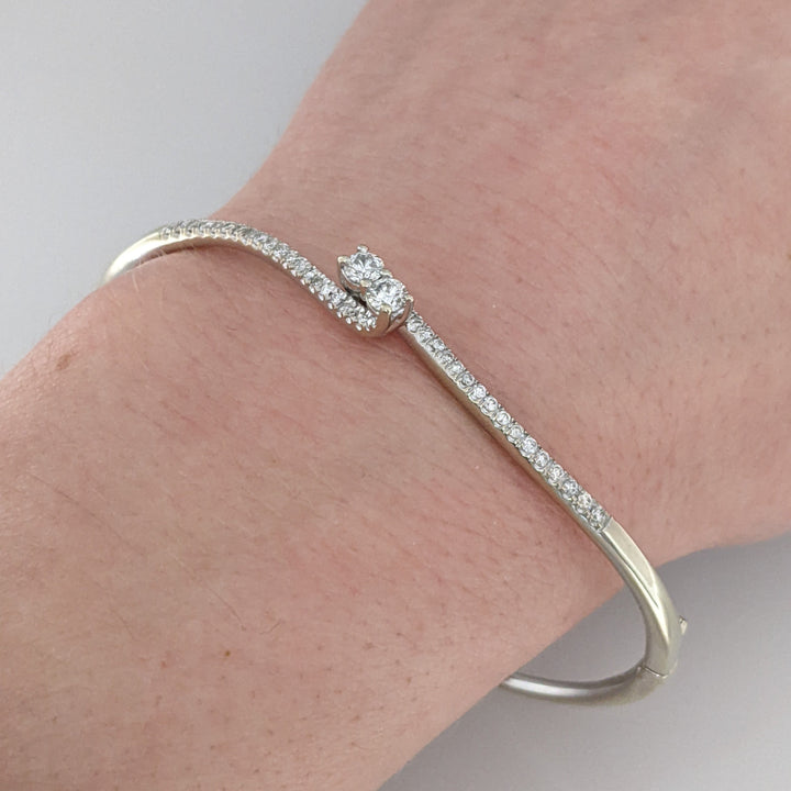 14K WHITE .79 CARAT TOTAL WEIGHT I1 I DIAMOND ROUND (44) BYPASS "EVER US" ESTATE BANGLE 10.8 GRAMS