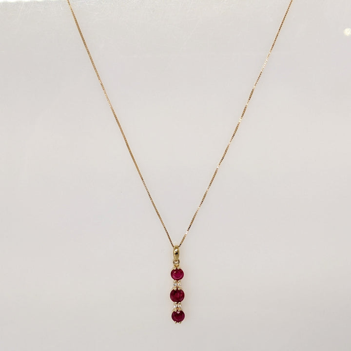 14K RUBY ROUND (1) 5.5MM (2) 4.5MM WITH (4) MELEE ESTATE PENDANT & CHAIN 2.6 GRAMS