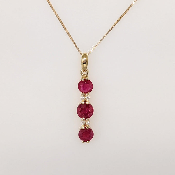 14K RUBY ROUND (1) 5.5MM (2) 4.5MM WITH (4) MELEE ESTATE PENDANT & CHAIN 2.6 GRAMS