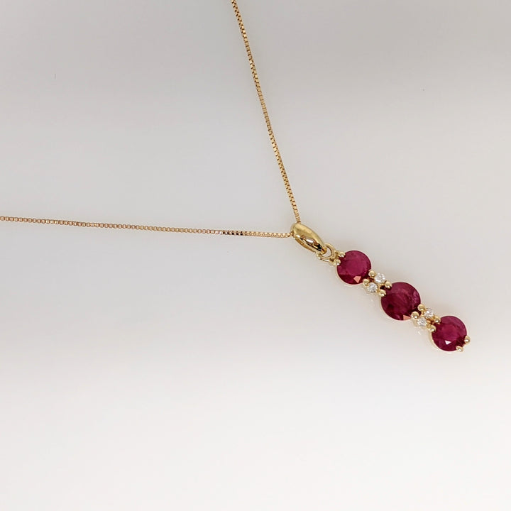 14K RUBY ROUND (1) 5.5MM (2) 4.5MM WITH (4) MELEE ESTATE PENDANT & CHAIN 2.6 GRAMS