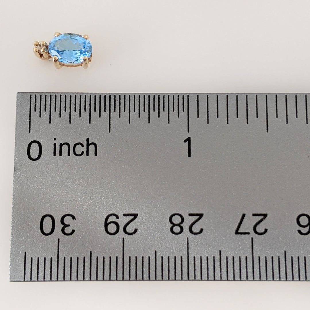 14K BLUE TOPAZ OVAL 5X7 WITH (2) MELEE ESTATE EARRINGS 1.7 GRAMS