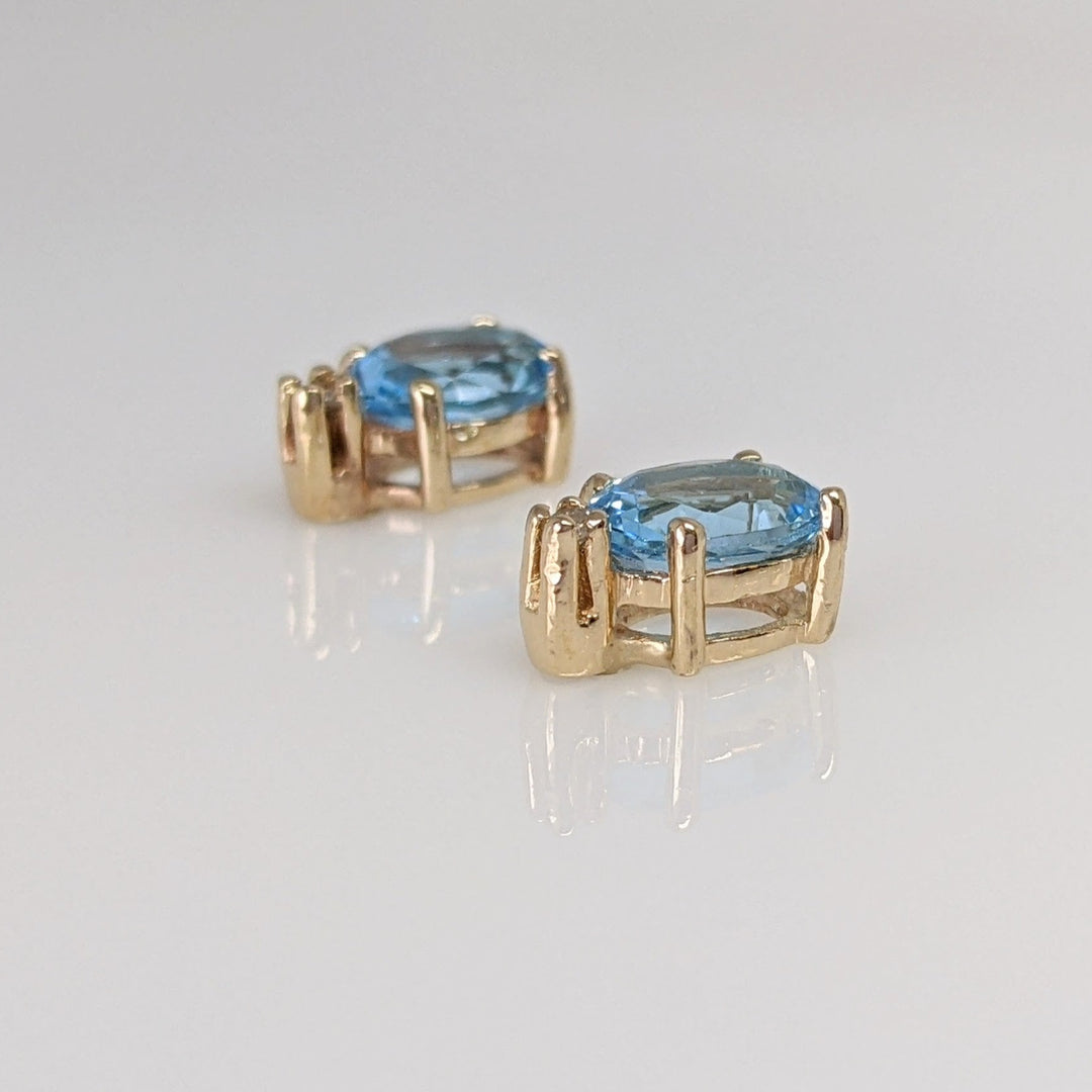 14K BLUE TOPAZ OVAL 5X7 WITH (2) MELEE ESTATE EARRINGS 1.7 GRAMS