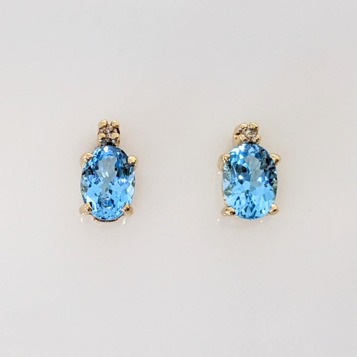 14K BLUE TOPAZ OVAL 5X7 WITH (2) MELEE ESTATE EARRINGS 1.7 GRAMS