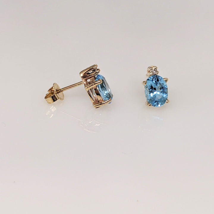 14K BLUE TOPAZ OVAL 5X7 WITH (2) MELEE ESTATE EARRINGS 1.7 GRAMS