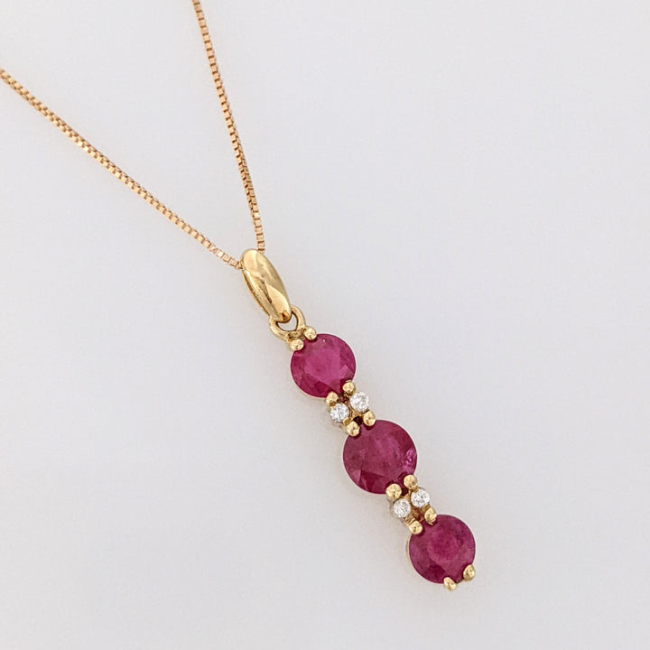 14K RUBY ROUND (1) 5.5MM (2) 4.5MM WITH (4) MELEE ESTATE PENDANT & CHAIN 2.6 GRAMS